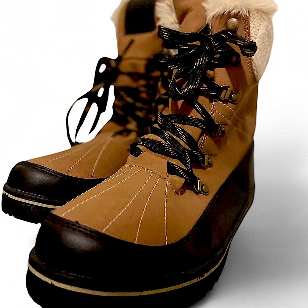 Tan and black water proof boots with faux fur lining